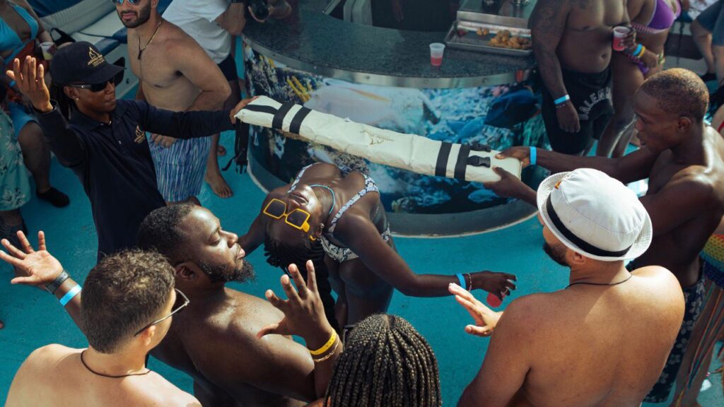Guests in the water beside the boat
