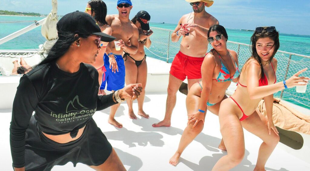 Guests dancing on the deck of the party boat
