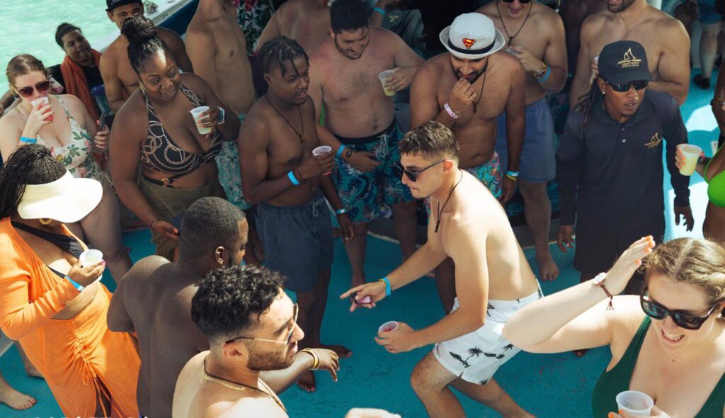 Group with drinks at the natural pool