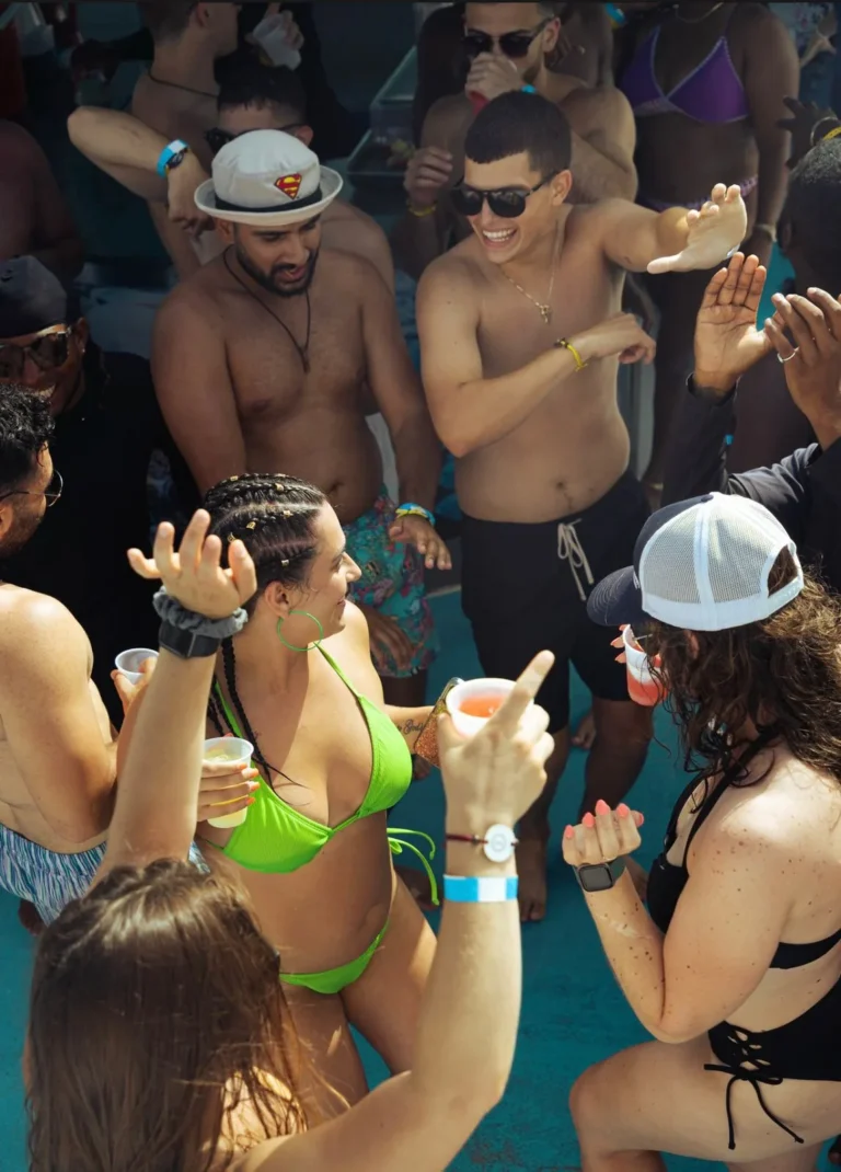 Group of guests dancing and celebrating on board in Punta Cana