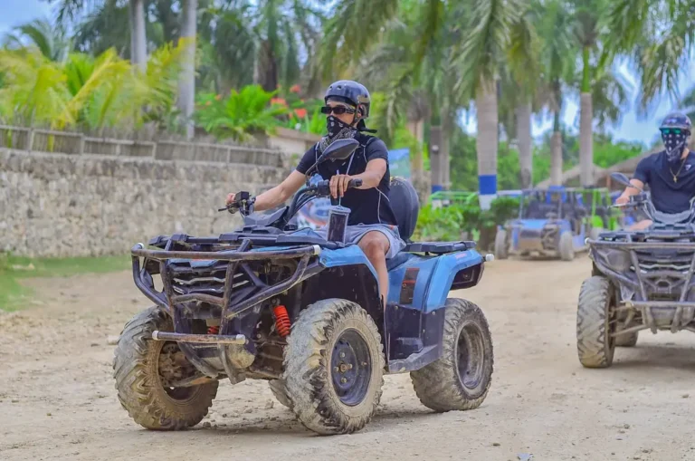 Line of ATVs on an open country road during the Punta Cana ride