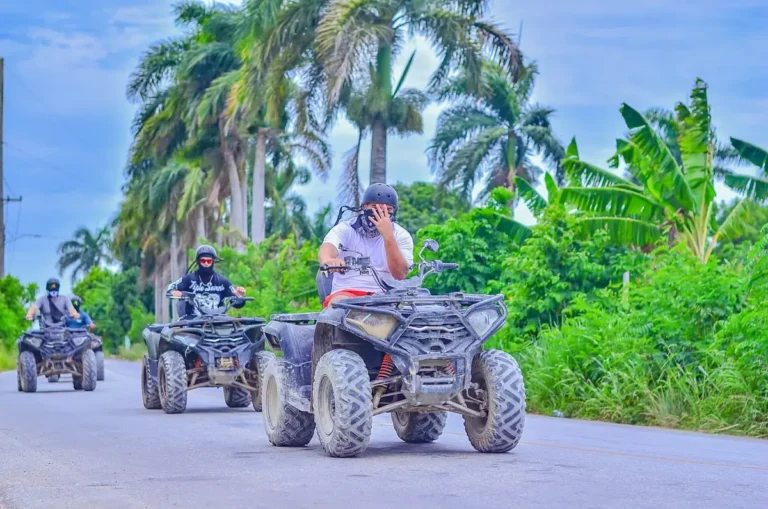 ATVs on a tropical trail past banana plants and palms in Punta Cana