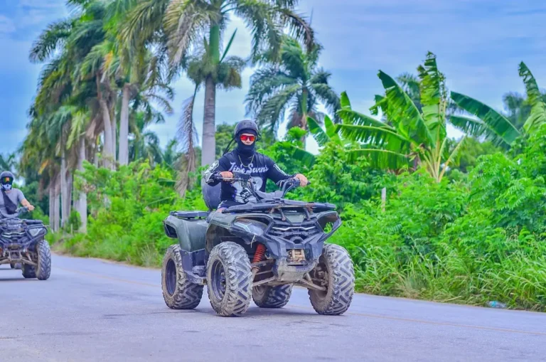 ATVs on a tropical trail past banana plants and palms in Punta Cana