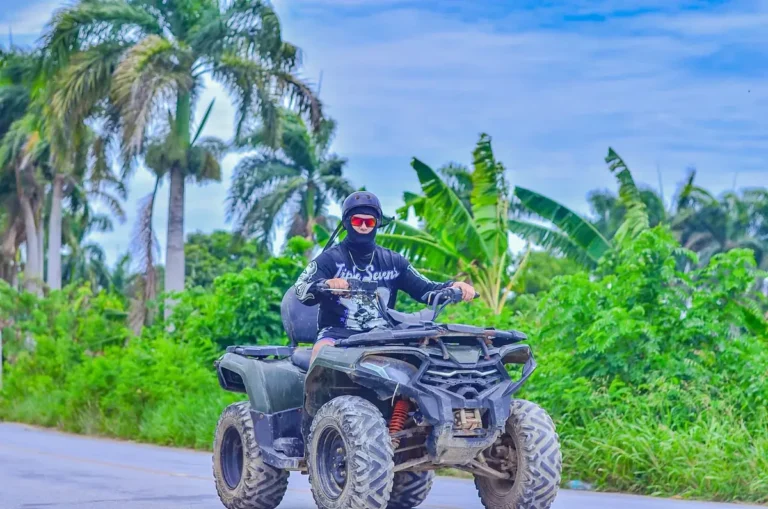 Guests riding ATVs through green countryside on the Punta Cana route