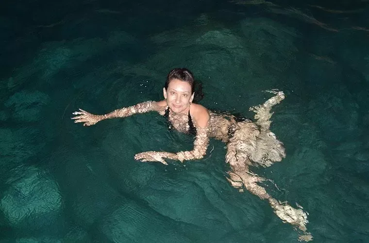 Guest swimming in the waters of a natural cave in Punta Cana