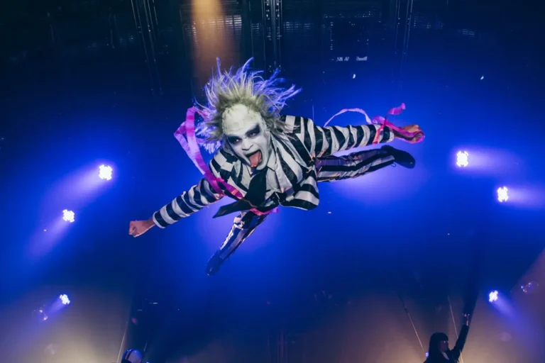 Performer dressed as Beetlejuice flying above the stage at Coco Bongo