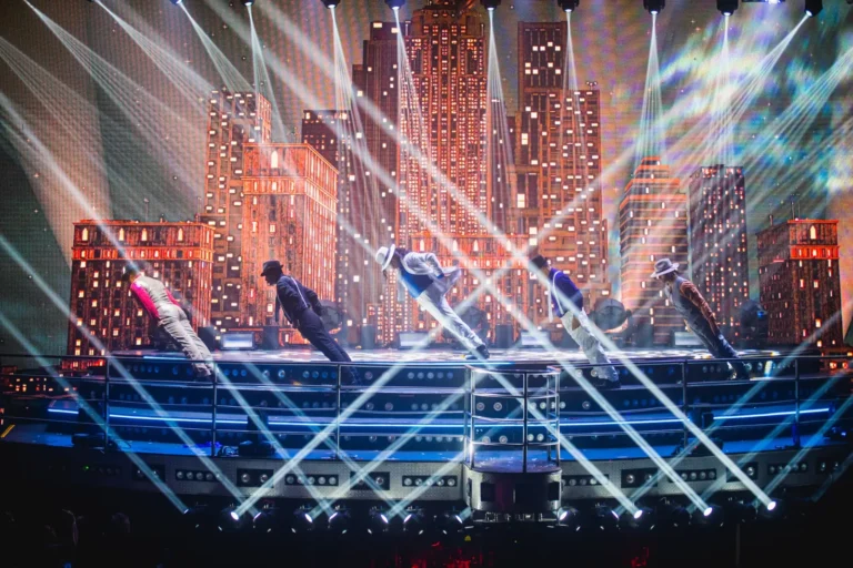 Dancers performing a Michael Jackson tribute among beams of light at Coco Bongo