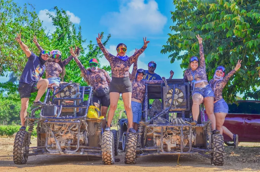 Group of friends celebrating on top of their buggies in Punta Cana