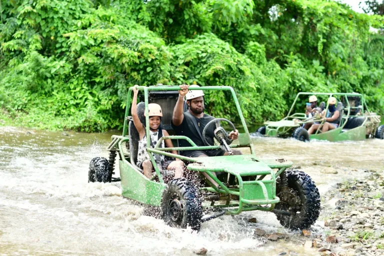 Green buggy crossing a puddle at La Hacienda Park