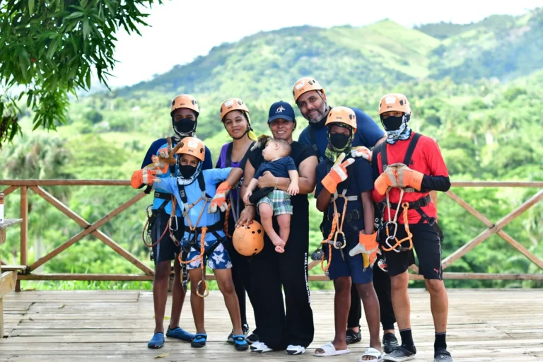 Group in zipline gear at a mountain lookout at La Hacienda Park