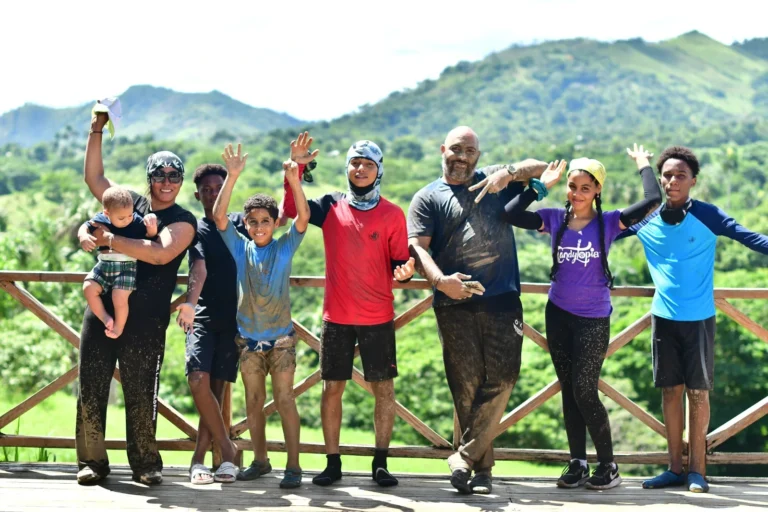 Group posing in front of the mountains at La Hacienda Park