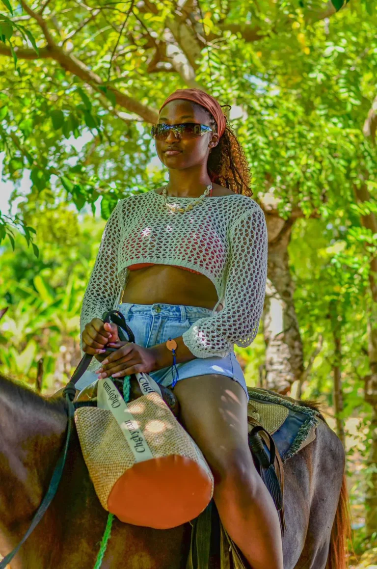 Guest on horseback among the trees in Punta Cana