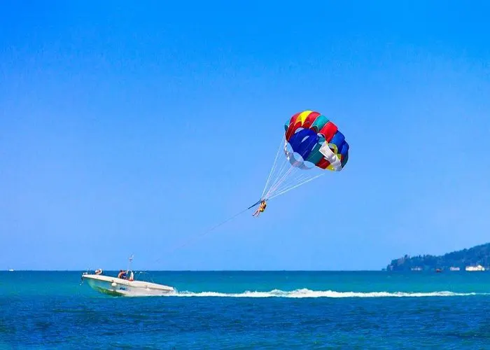 Boat towing a parasail over the Caribbean Sea near Punta Cana