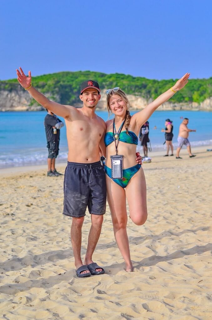 Couple celebrating on the beach during a King Black day out