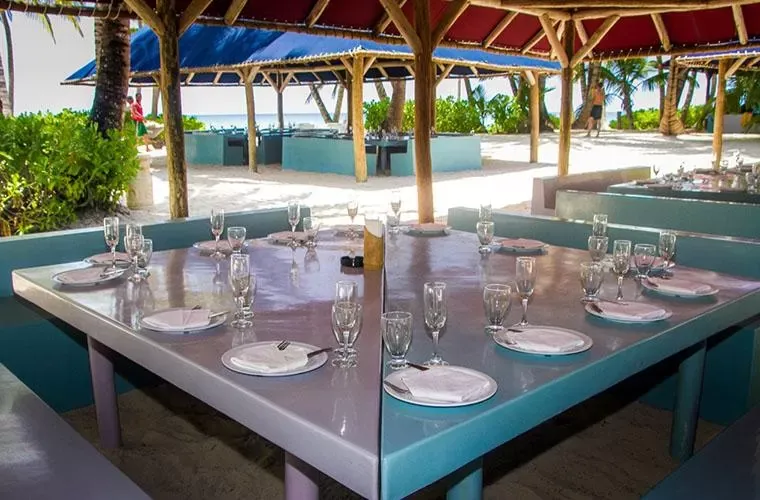 Lunch tables laid out by the sea on Saona Island