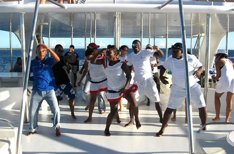 Guests dancing on the catamaran deck on the way back from Saona Island