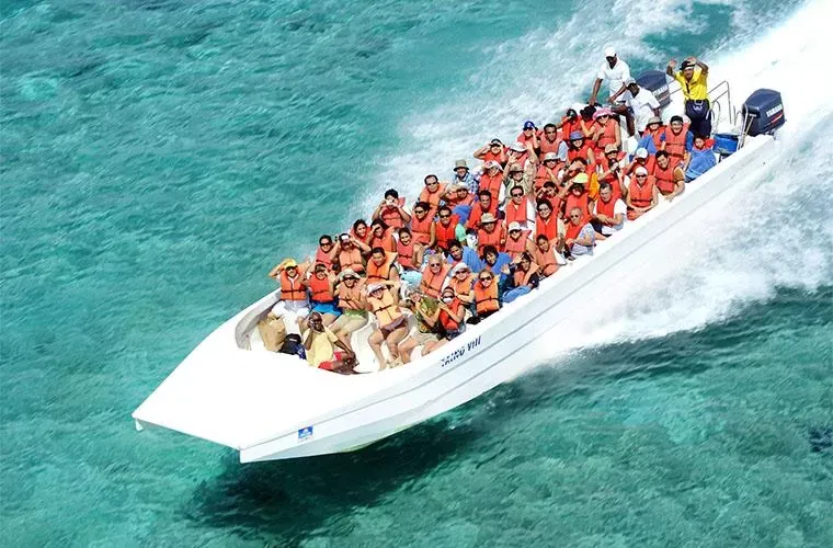 Guests in life jackets on the speedboat to Saona Island