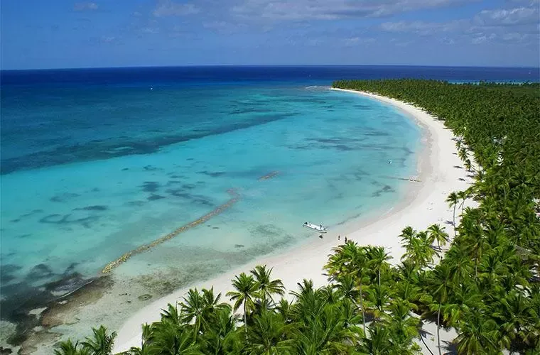 Aerial view of the curve of white sand at Saona Island