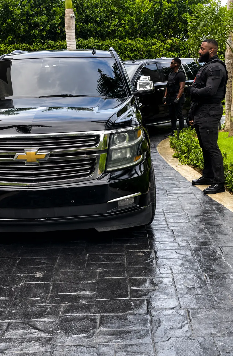 King Black protection detail with two black SUVs at a private villa in Punta Cana