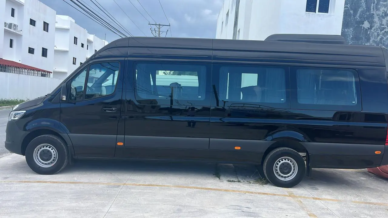 Black Mercedes-Benz Sprinter seen from the side in Punta Cana